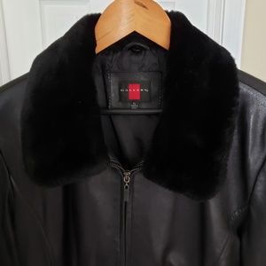 Black leather jacket with detachable fur collar.